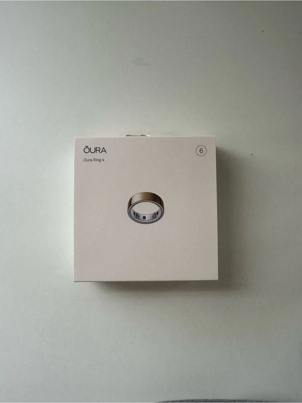 Oura Ring 4 Box with Gold Ring Illustration